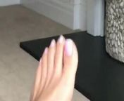 Feet play with toenails with white nail polish from feet with white nails