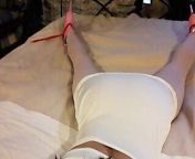Laura is wearing a sexy white dress, pink pantyhose and platform heels, tied up and gagged in a bed from tied up balls boots