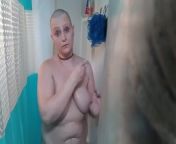 Bald girl in the shower after headshave from headshave