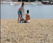Milf Lilly naked on public beach got oil massage from stranger from nakedtoll